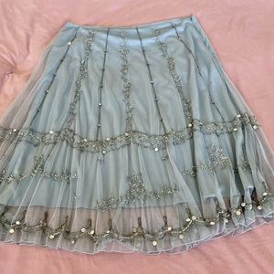 Sky blue embellished skirt with fine net overlay, silver sequins and beading